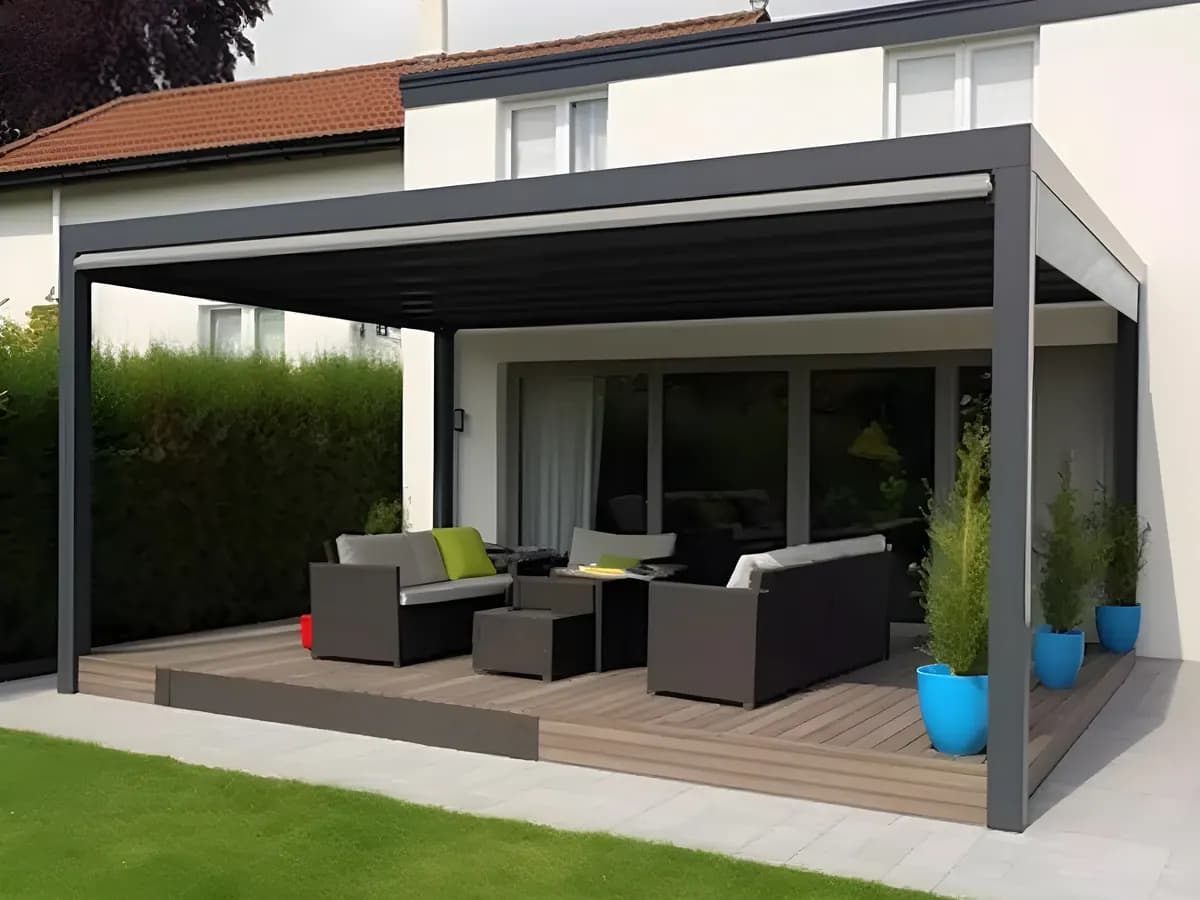 Concept render: wall-mounted dark louvred roof over a lounge beside a house